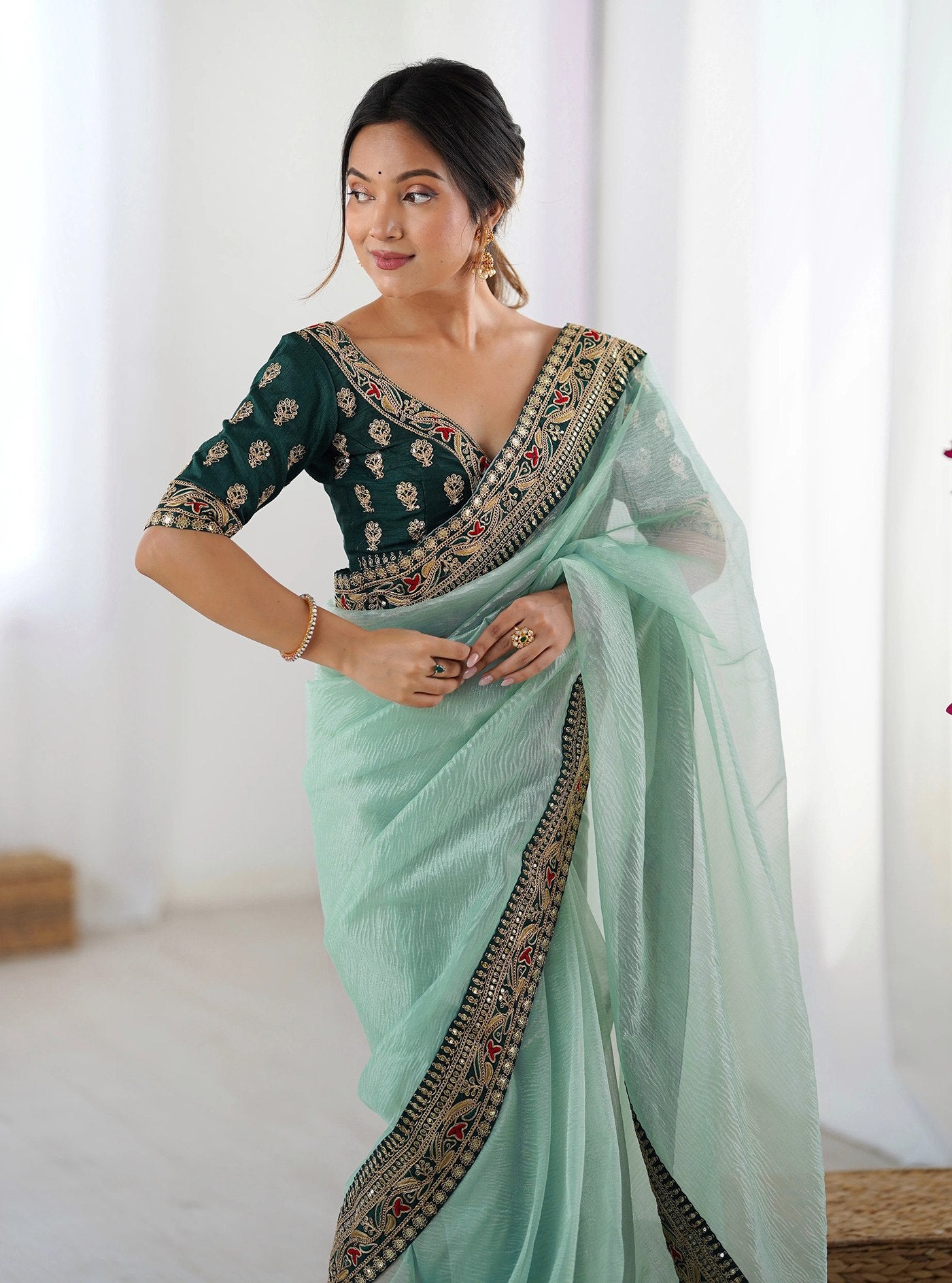 Torquoise Net Saree with Bottle Green Embroidered Silk Blouse & Scalloped Border