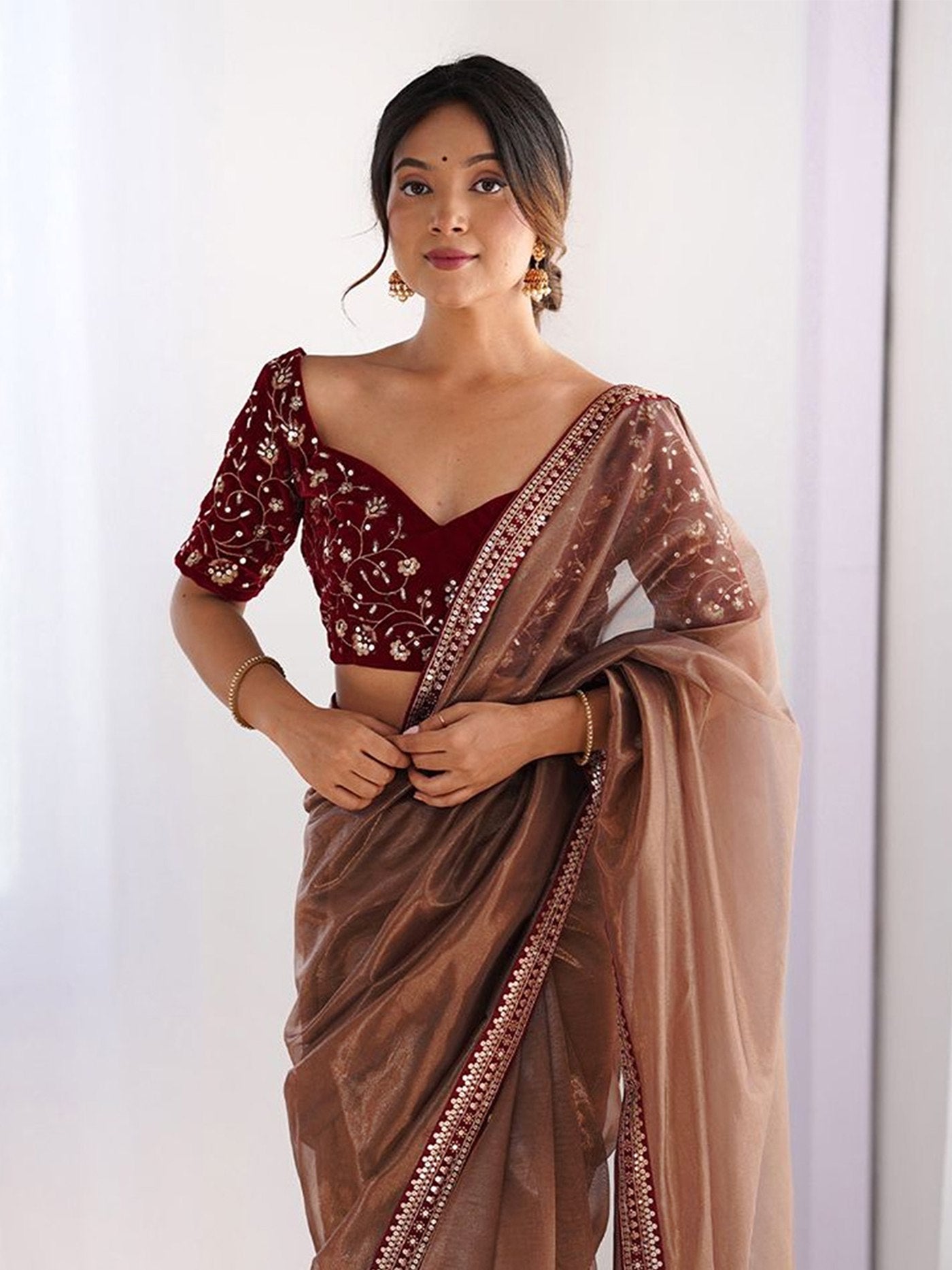 Shimmer Net Saree with Heavily Embroidered Velvet Blouse