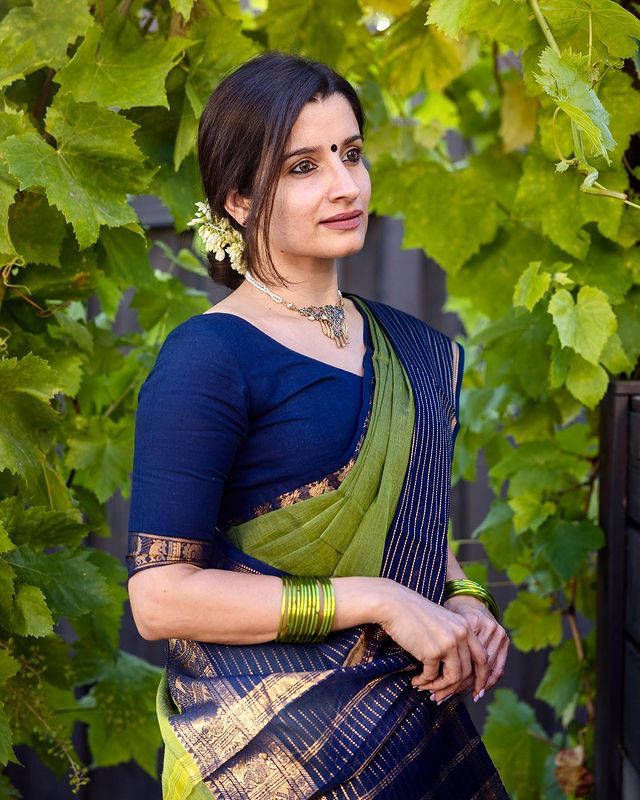 Moss Green Banarasi Silk Saree featuring Traditional Navy Borders