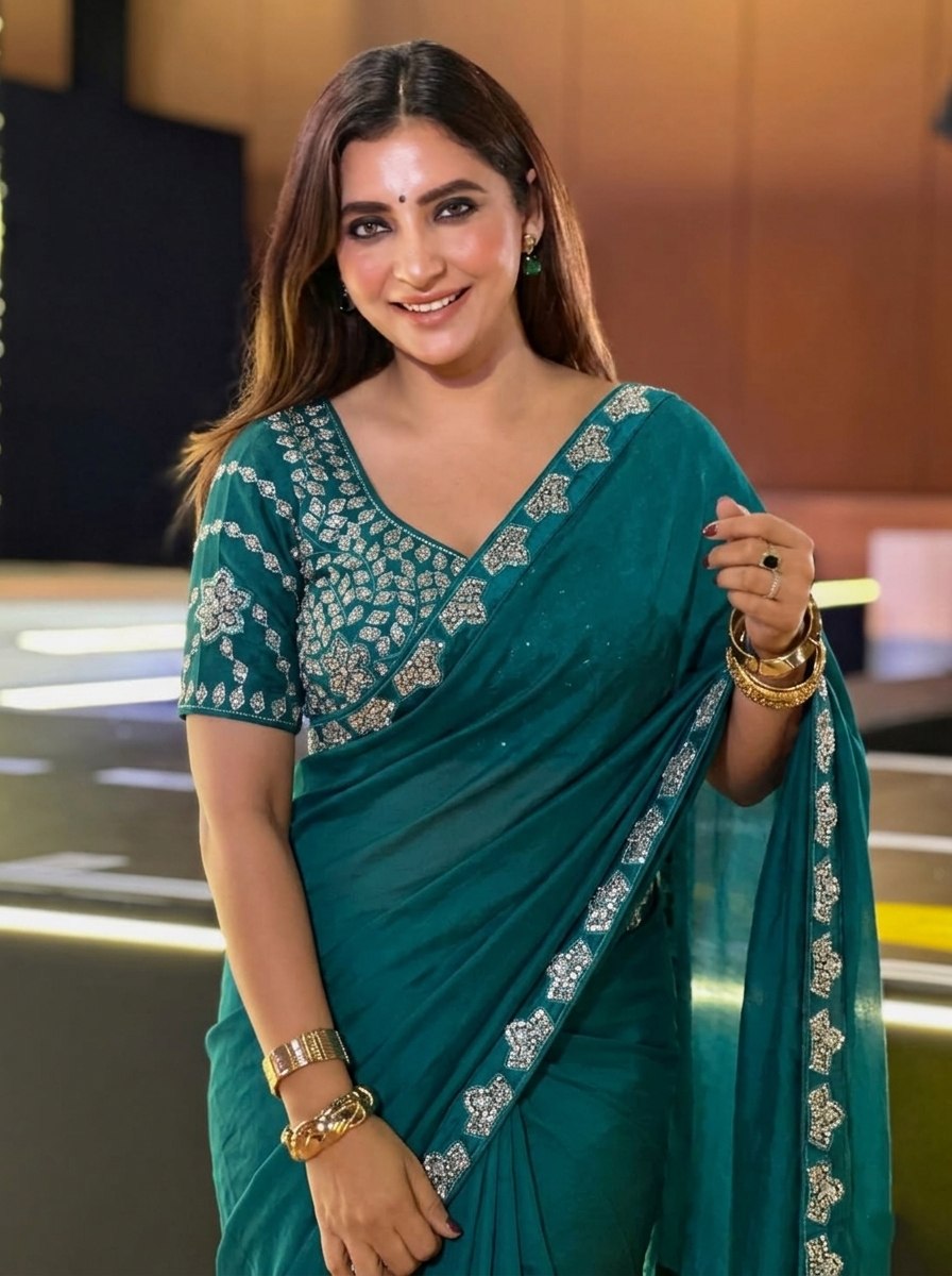 Teal Blue Silk-Blend Saree with Geometric Silver Zari Border and Heavy Embroidered Blouse Stitched