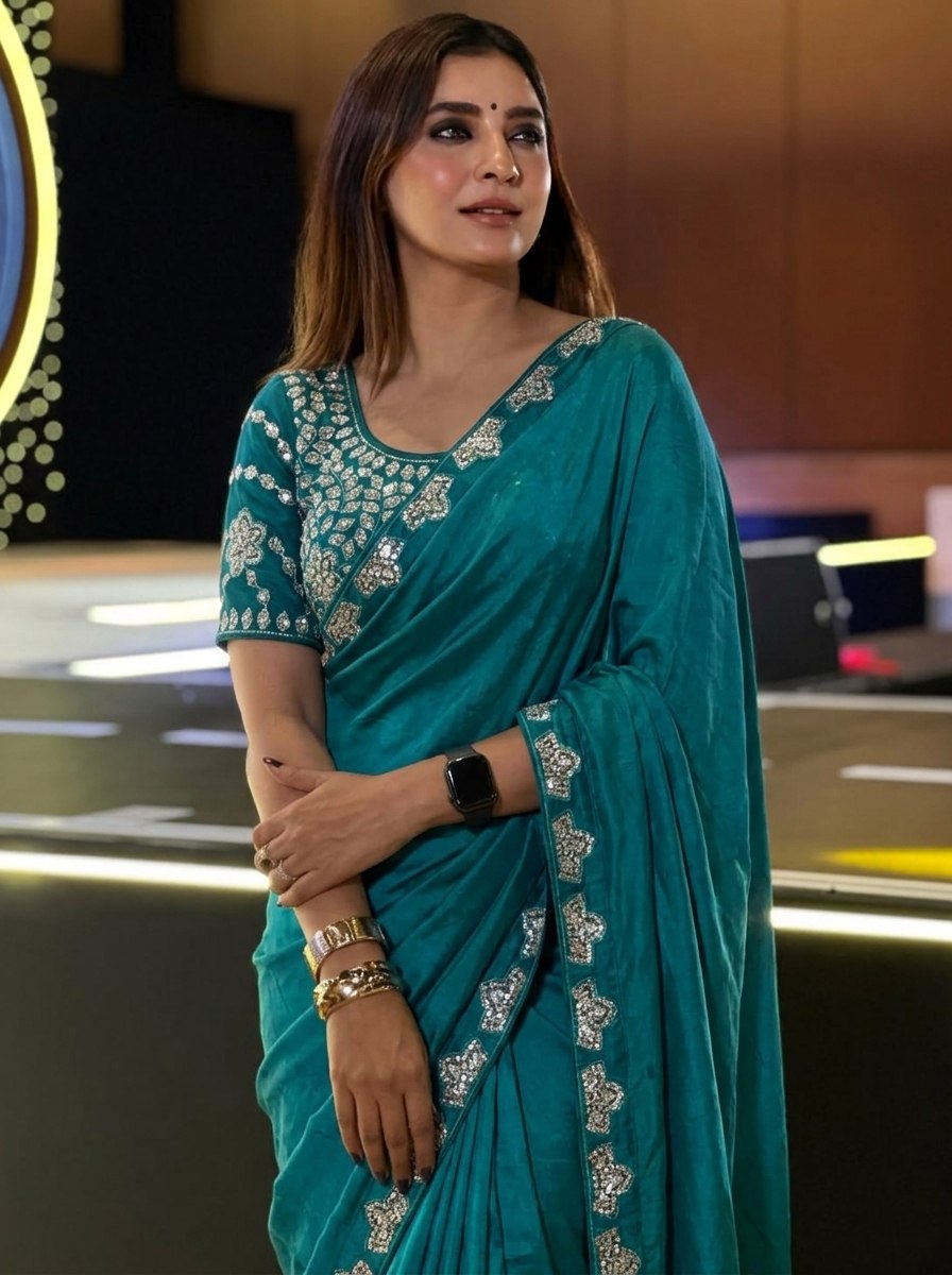 Teal Blue Silk-Blend Saree with Geometric Silver Zari Border and Heavy Embroidered Blouse Stitched