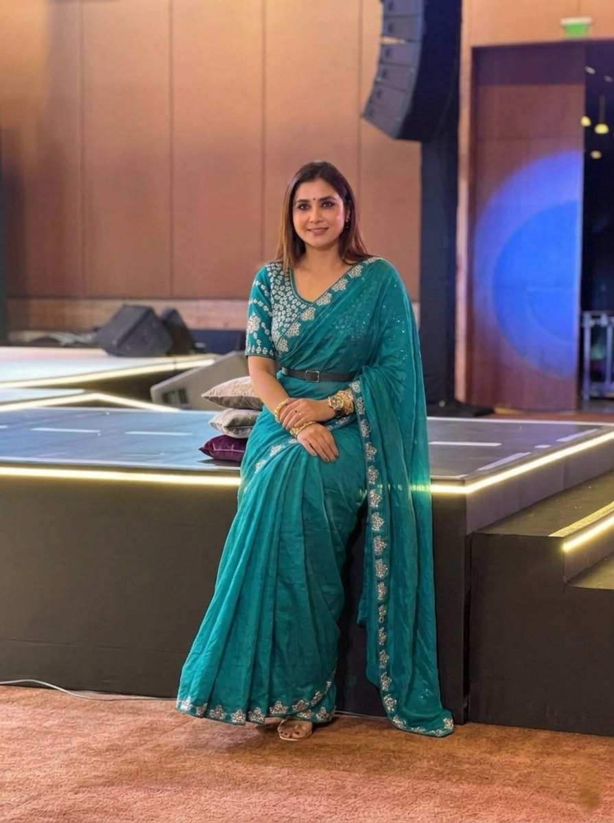 Teal Blue Silk-Blend Saree with Geometric Silver Zari Border and Heavy Embroidered Blouse Stitched