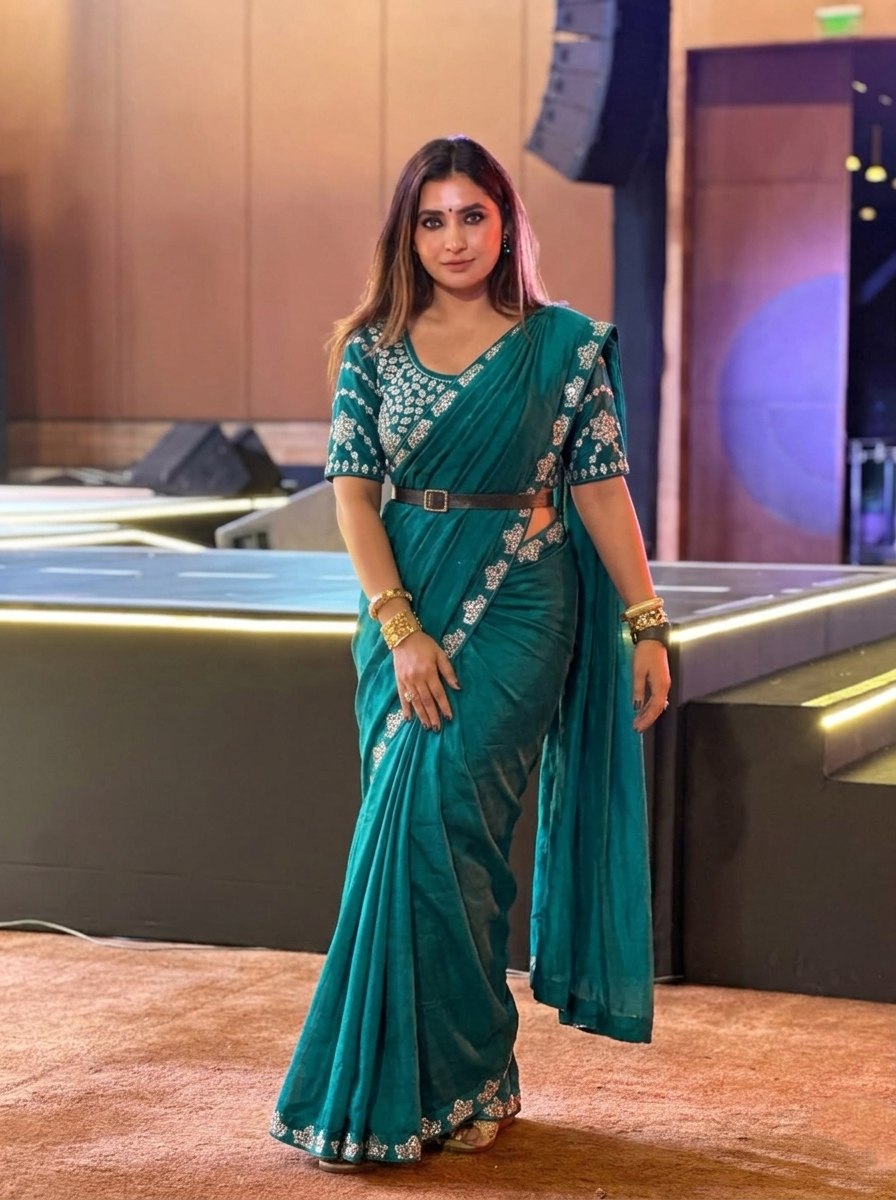 Teal Blue Silk-Blend Saree with Geometric Silver Zari Border and Heavy Embroidered Blouse Stitched