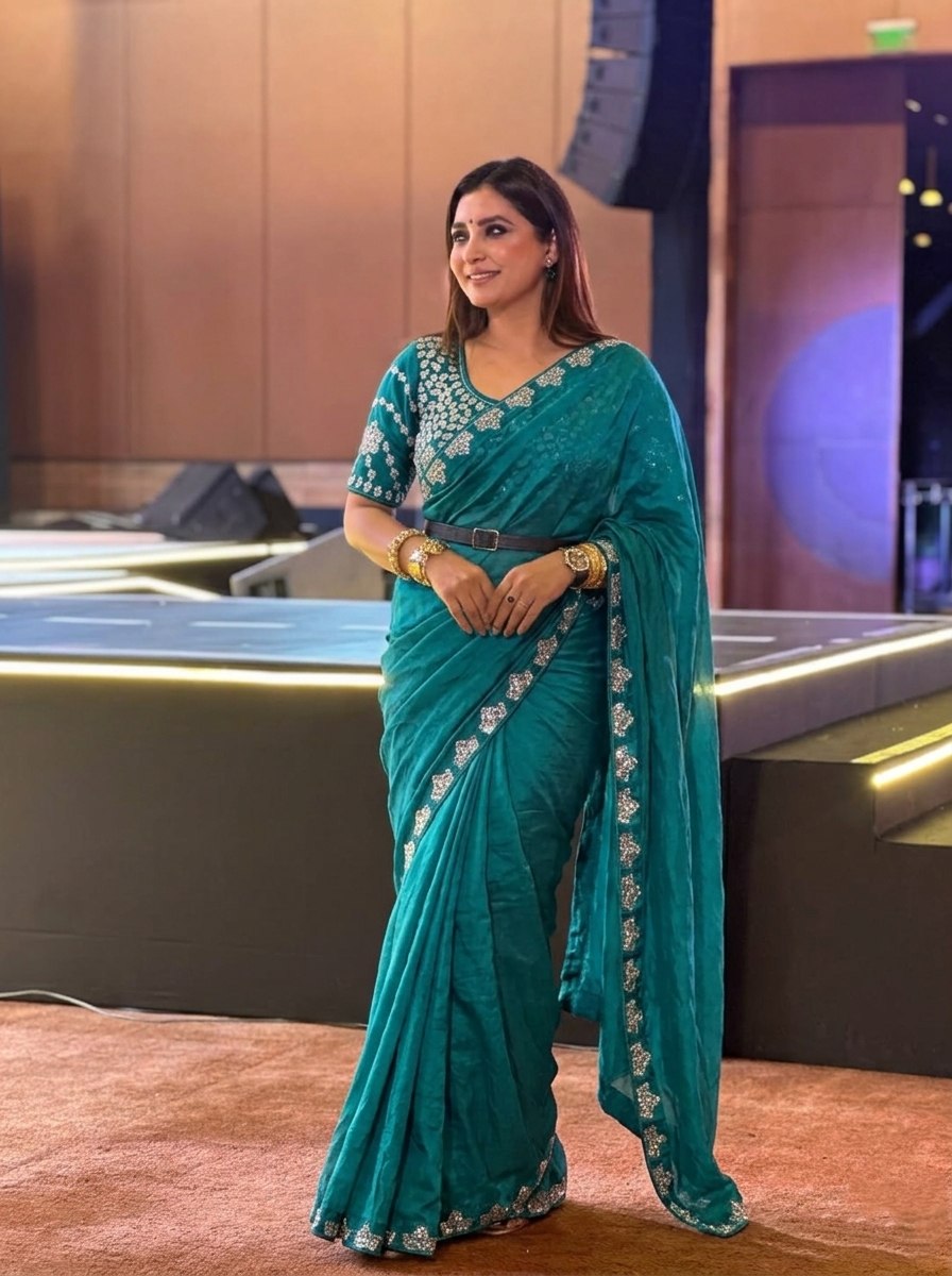 Teal Blue Silk-Blend Saree with Geometric Silver Zari Border and Heavy Embroidered Blouse Stitched