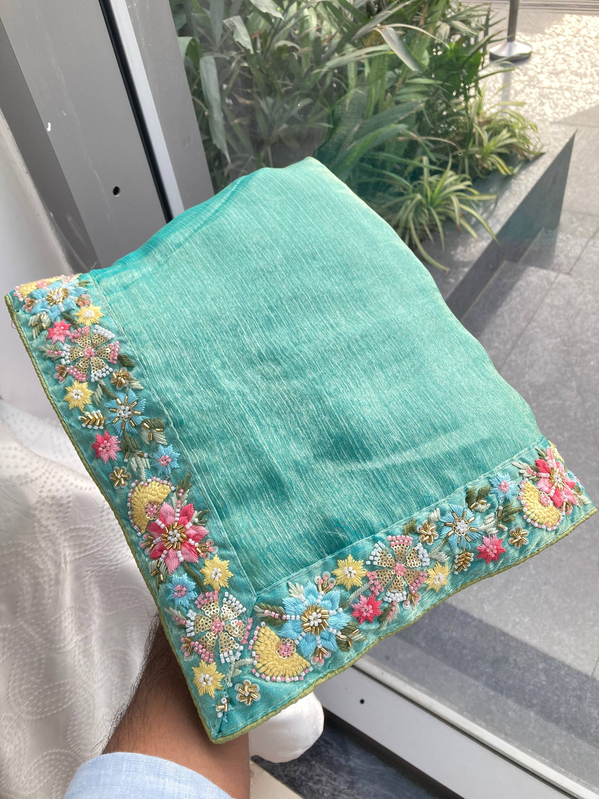 Ethereal Teal Silk Tissue Saree with Multi-Colored Floral Embroidery